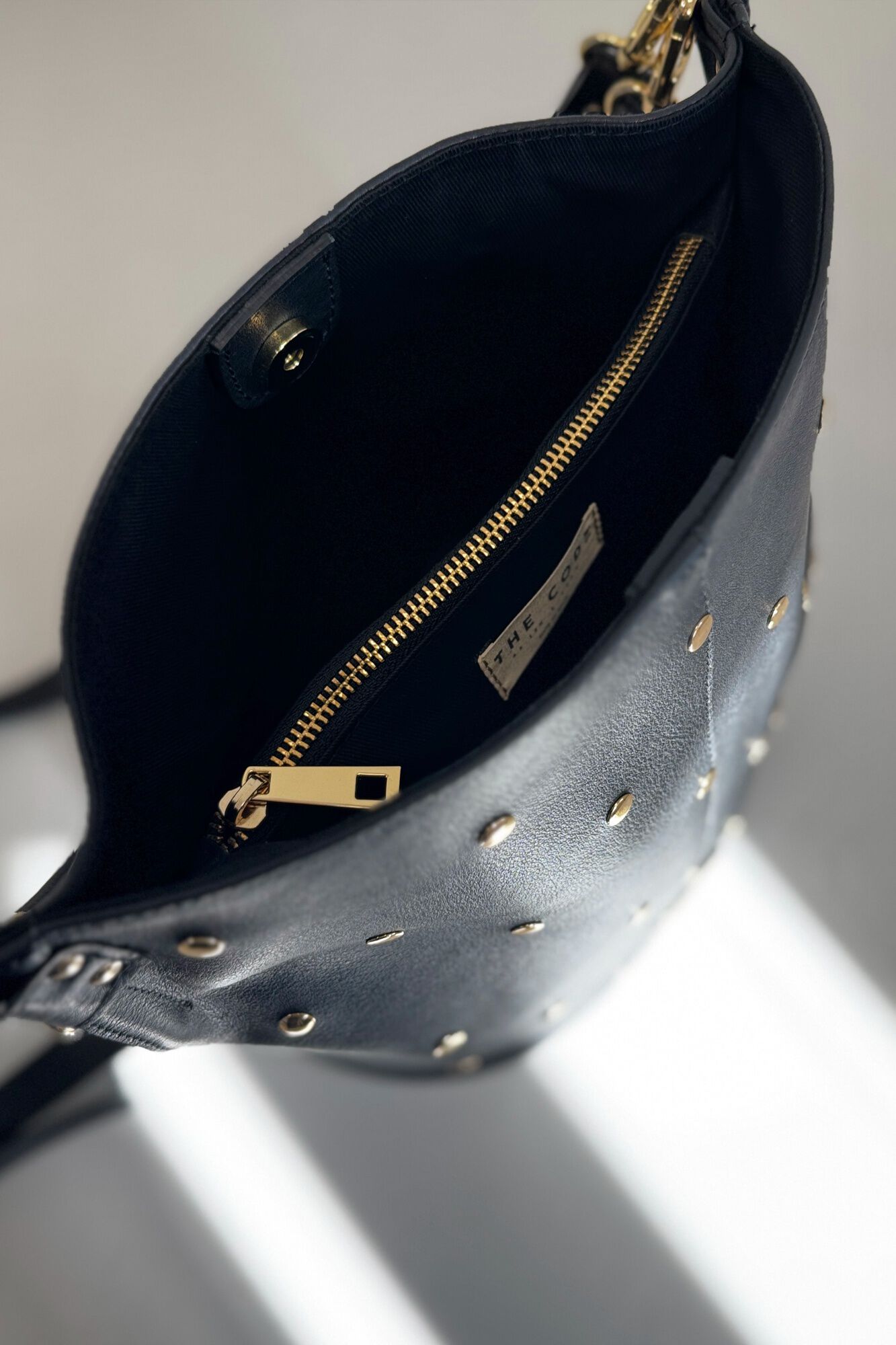 The Code Julieta leather and stud pouch bag Black