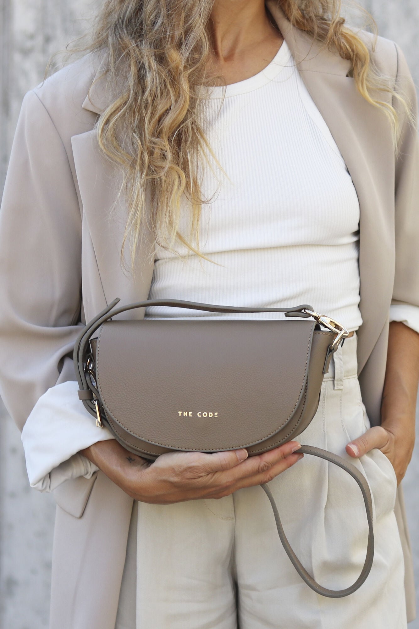 The Code Alma bag in taupe leather  Beige